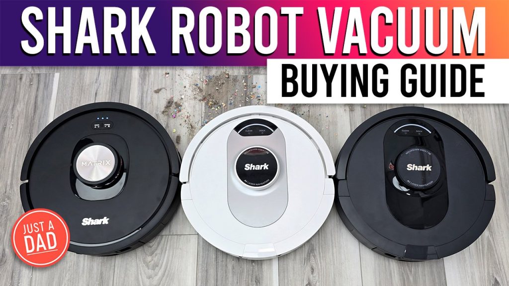 A modern robot vacuum cleaner sits on a clean wooden living room floor.